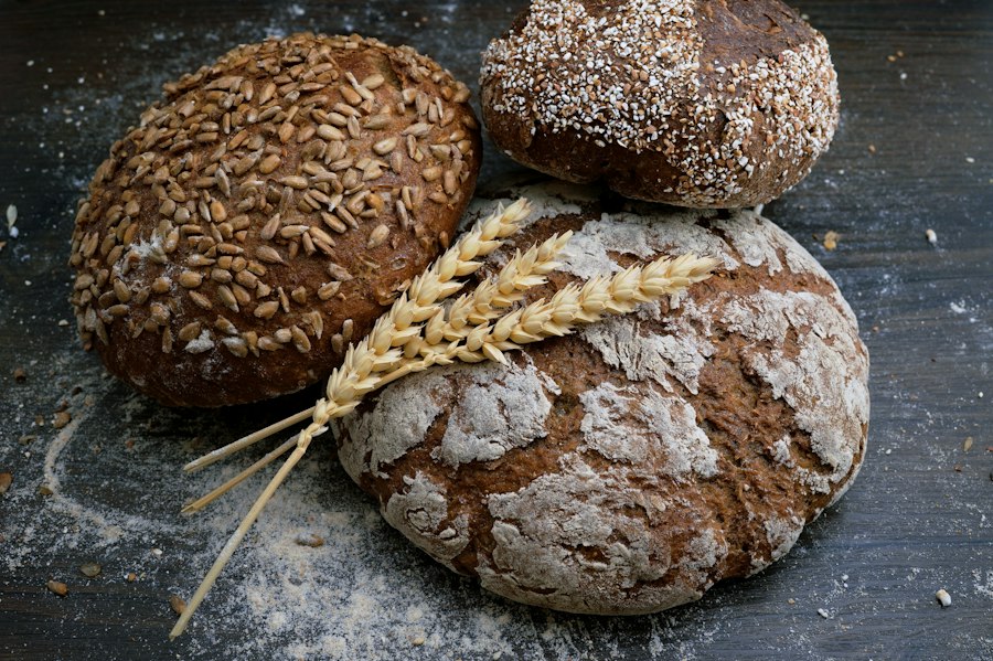Rustic whole grain loaves with wheat stalks