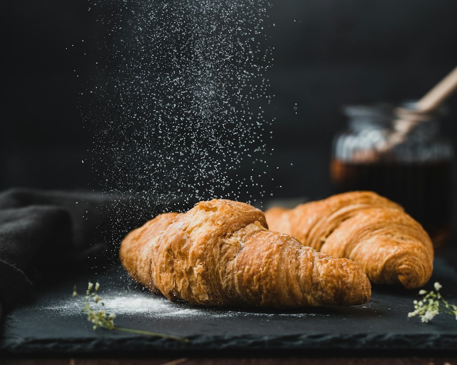 Butter croissants dusted with powdered sugar